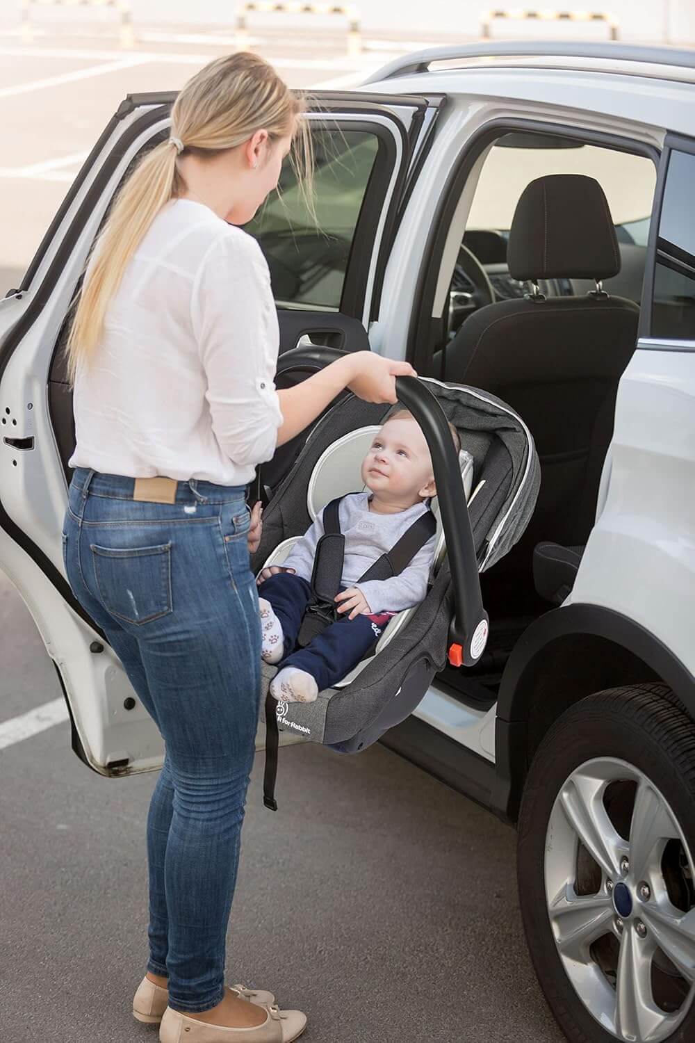 Versatile R for Rabbit Picaboo baby carry cot and car seat, offering 4-in-1 functionality including rocker and feeding chair, with a comfortable and colorful interior for infant safety and comfort. www.usmile.toys